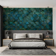 Art deco teal and gold scale wallpaper in modern living room with grey sofa and brass accents