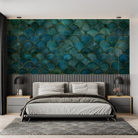 Art deco teal and gold scale wallpaper in modern living room with grey sofa and brass accents