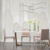 Art deco gold arch wallpaper in modern living room with grey sofa and natural light