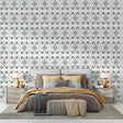 Art Nouveau green floral wallpaper in a bright modern living room showing geometric pattern detail