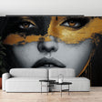 Black and gold portrait wallpaper making a bold statement in a modern living room with minimal furniture