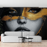 Black and gold portrait wallpaper making a bold statement in a modern living room with minimal furniture
