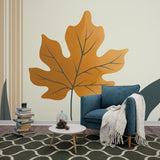 Modern orange leaf wallpaper creating a stunning backdrop in a bright, contemporary living room with minimal furniture