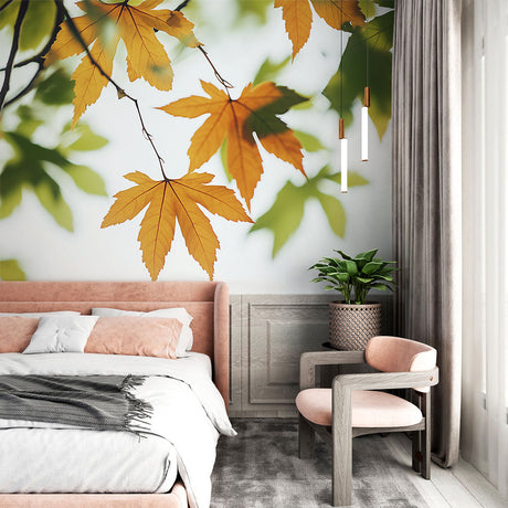 Autumn leaves wallpaper mural showcased in a bright modern living room, golden maple leaves creating a warm atmosphere