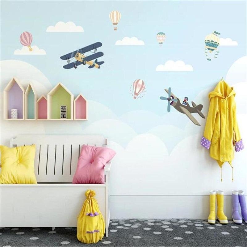 Modern kids study area with gentle aviation wallpaper design creating depth