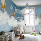 Aviation wallpaper mural with hot air balloons in modern nursery, creating a dreamy atmosphere
