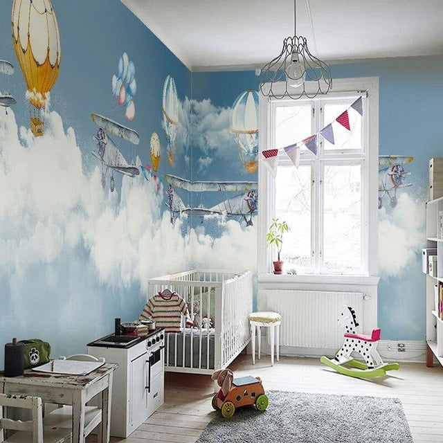 Aviation wallpaper mural with hot air balloons in modern nursery, creating a dreamy atmosphere