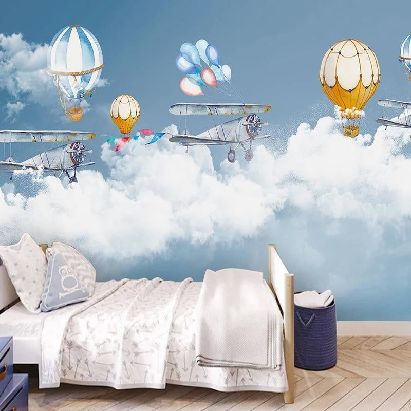 Aviation themed playroom with hot air balloon wall mural showcasing peaceful blue tones