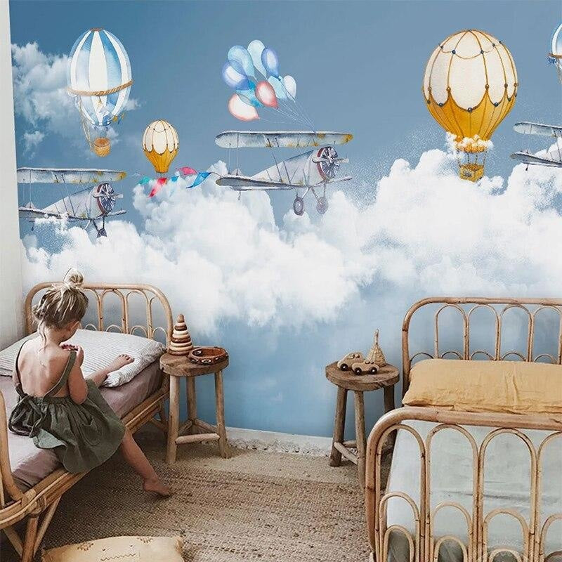 Study space decorated with aviation themed wallpaper showing floating balloons and planes