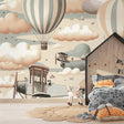 Aviation wallpaper creating a cozy reading nook with vintage hot air balloons floating above a comfortable chair