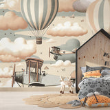 Aviation wallpaper creating a cozy reading nook with vintage hot air balloons floating above a comfortable chair