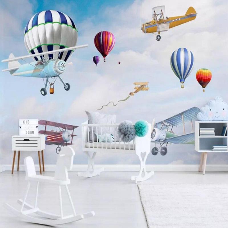 Playroom featuring vintage aircraft wallpaper with colorful hot air balloons and planes