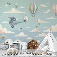 Aviation wallpaper with vintage planes and hot air balloons creating a dreamy atmosphere in a modern nursery