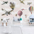 Aviation wallpaper mural styled in modern nursery with vintage planes and hot air balloons creating a dreamy atmosphere