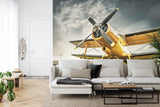 Vintage aviation wallpaper creating a bold statement in a modern home office with natural lighting