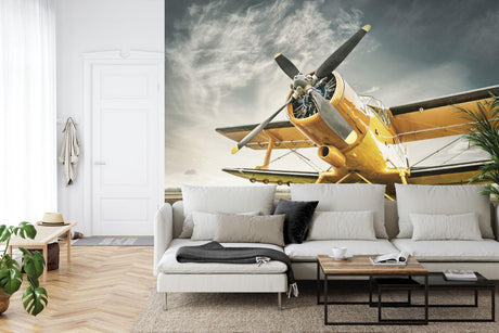 Vintage aviation wallpaper creating a bold statement in a modern home office with natural lighting