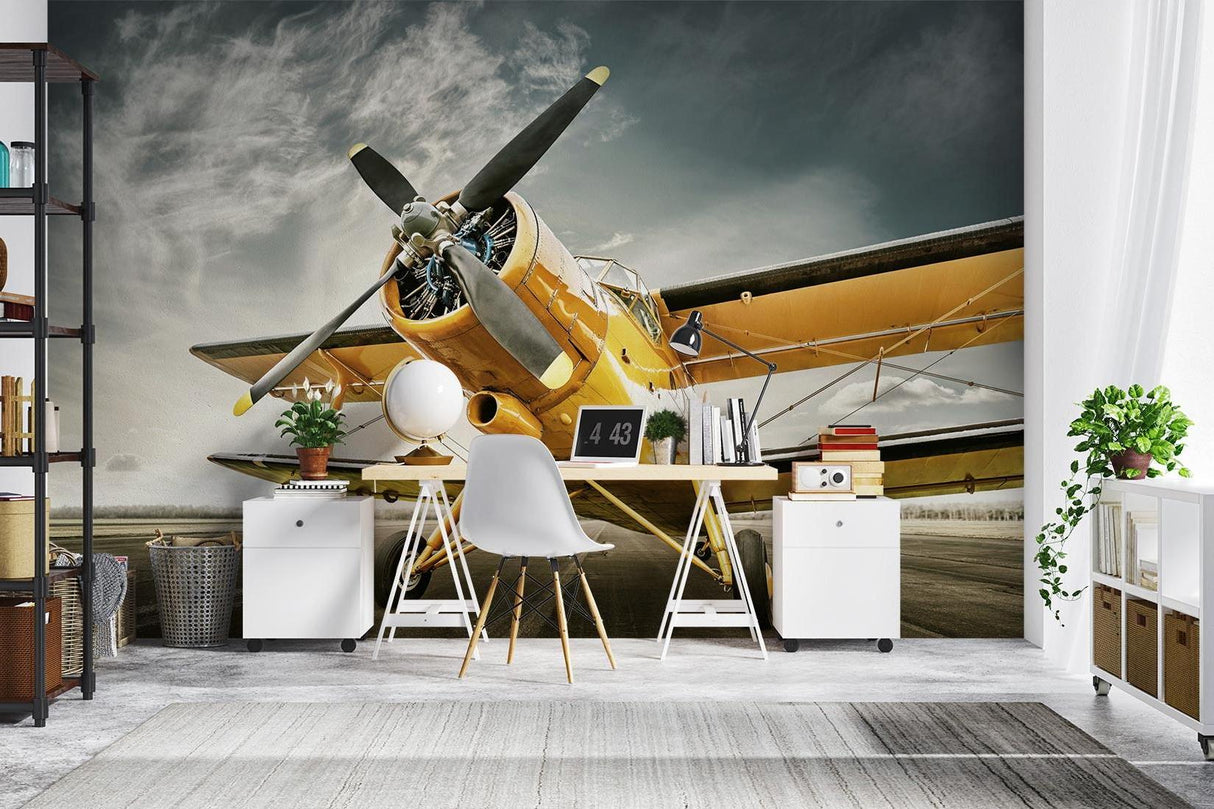 Yellow airplane mural wallpaper installed in a stylish living room with contemporary furniture