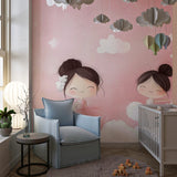 Ballerina wallpaper in a bright nursery with white furniture showing the gentle pink tones and dancing figures