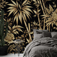 Black and gold bamboo wallpaper creating dramatic impact in a modern dining room with pendant lighting