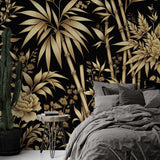 Black and gold bamboo wallpaper creating dramatic impact in a modern dining room with pendant lighting