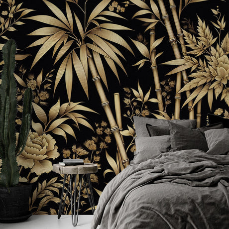 Black and gold bamboo wallpaper creating dramatic impact in a modern dining room with pendant lighting