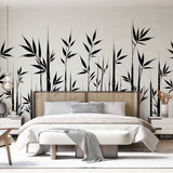 Black and white bamboo wallpaper creating a zen atmosphere in a modern minimalist living room with natural light