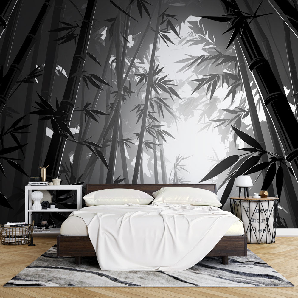 Black and white bamboo forest wallpaper creating a zen atmosphere in a modern minimalist living room with natural light