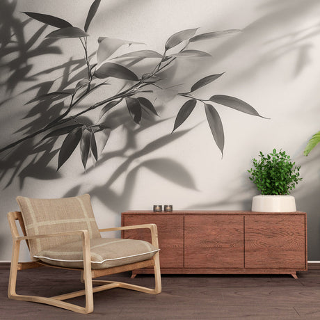 Black and white bamboo shadow wallpaper creating a zen atmosphere in a modern minimalist living room