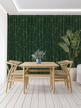 Green bamboo wallpaper adding depth to a minimalist dining space