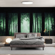 Bamboo forest wallpaper creating a zen atmosphere in a modern living room with emerald green misty effect