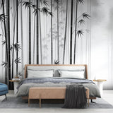 Black and white Bamboo Forest Wallpaper creating a stunning feature wall in a modern living room with minimalist furniture