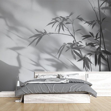 Bamboo shadow wallpaper creating a serene atmosphere in a modern minimalist living room with natural light