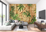 Tropical bamboo wall mural in a cozy bedroom setting with golden accents