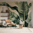 Tropical banana leaf wallpaper mural showcased in a modern living room with white furniture and natural light