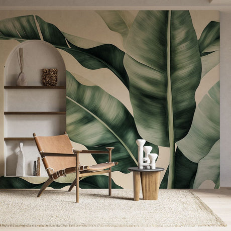 Tropical banana leaf wallpaper mural showcased in a modern living room with white furniture and natural light