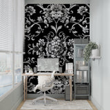Black and silver baroque wallpaper in elegant living room with high ceilings