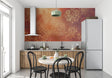 Baroque damask wallpaper in warm terracotta and gold tones creating an elegant dining room atmosphere
