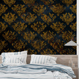 Baroque wallpaper in elegant dining room showing gold damask pattern against black background