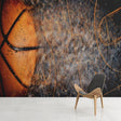 Basketball wallpaper mural styled in modern game room with orange accent lighting and sleek furniture