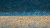Abstract coastal design file showing detailed sand and sea pattern with rich blue ocean tones