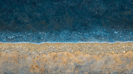 Abstract coastal design file showing detailed sand and sea pattern with rich blue ocean tones