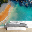 Coastal paradise beach wallpaper creating a bright, airy atmosphere in a modern living room with white furniture