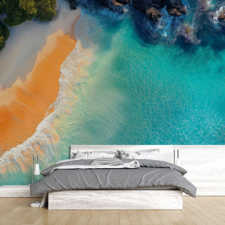 Coastal paradise beach wallpaper creating a bright, airy atmosphere in a modern living room with white furniture