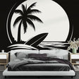 Black and white beach mural wallpaper creating a modern coastal feel in a minimalist living room with clean furniture lines