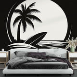 Black and white beach mural wallpaper creating a modern coastal feel in a minimalist living room with clean furniture lines