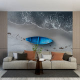 Beach mural wallpaper showcasing a blue boat design in a bright modern living room with coastal decor