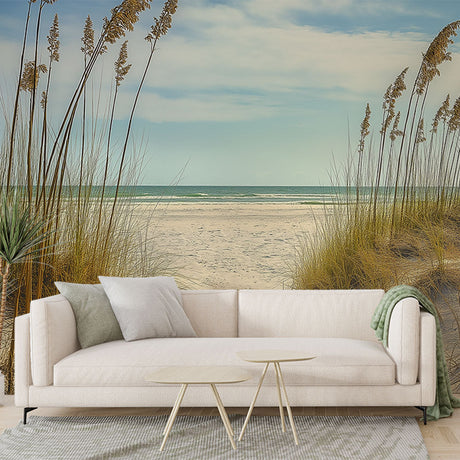 Beach landscape wallpaper creating a serene coastal atmosphere in a modern living room with natural light
