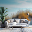 Coastal sand dune wallpaper creating a peaceful atmosphere in a modern living room with natural light