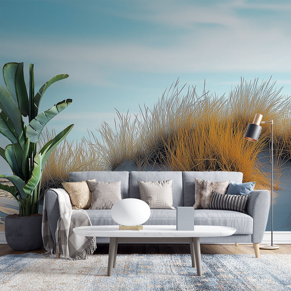 Coastal sand dune wallpaper creating a peaceful atmosphere in a modern living room with natural light