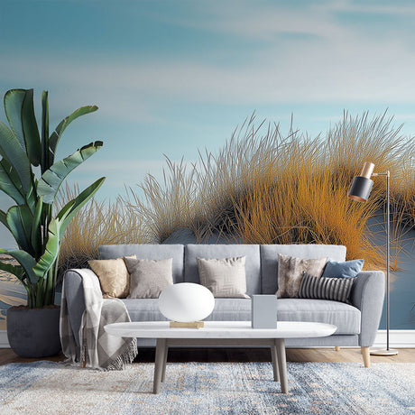 Coastal sand dune wallpaper creating a peaceful atmosphere in a modern living room with natural light